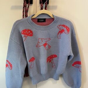 Cider Blue and Red Crew Neck Sweater with Whimsical Mushroom Design